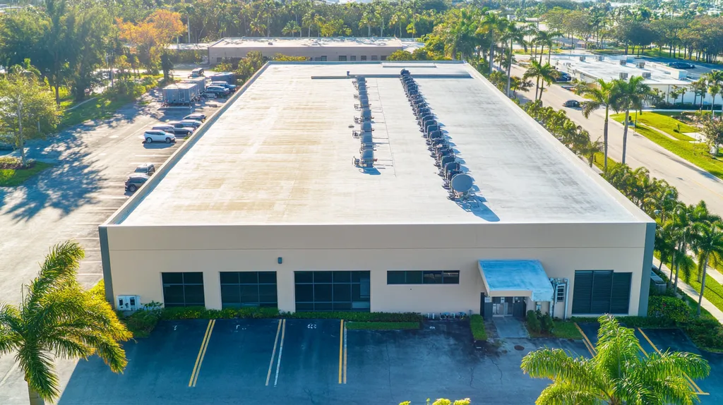 A commercial roof on a call center in a location similar to Miami with a color highlight aesthetic (AI image)