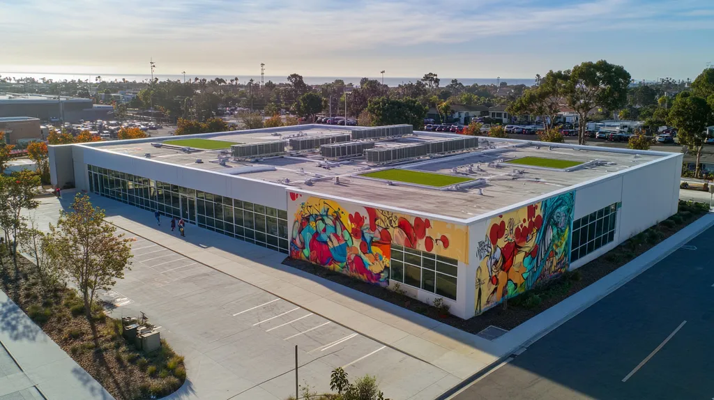A commercial roof on a community recreation center in a location similar to Newport Beach with a graffiti mural aesthetic (AI image)