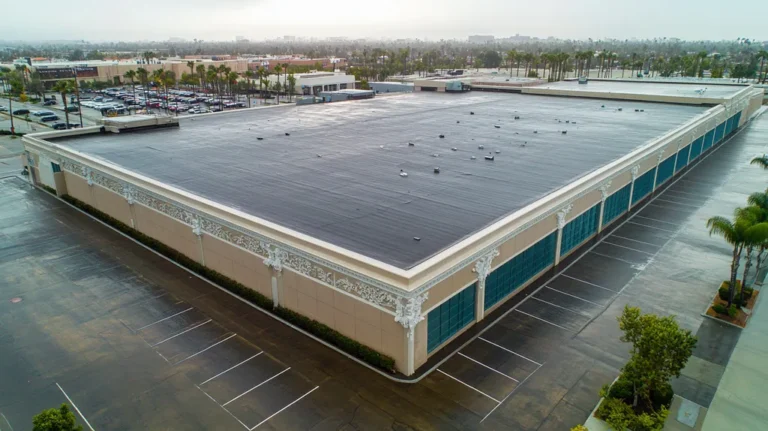 A commercial roof on a convention center in a location similar to Los Angeles with a rainy day aesthetic (AI image)