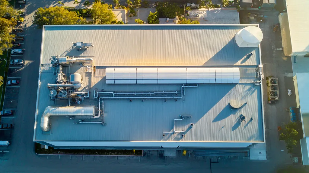 A commercial roof on a factory in a location similar to Key West with a futuristic aesthetic (AI image)