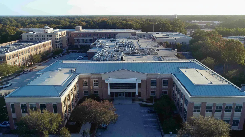 A commercial roof on a hospital in a location similar to Savannah with an urban context aesthetic (AI image)