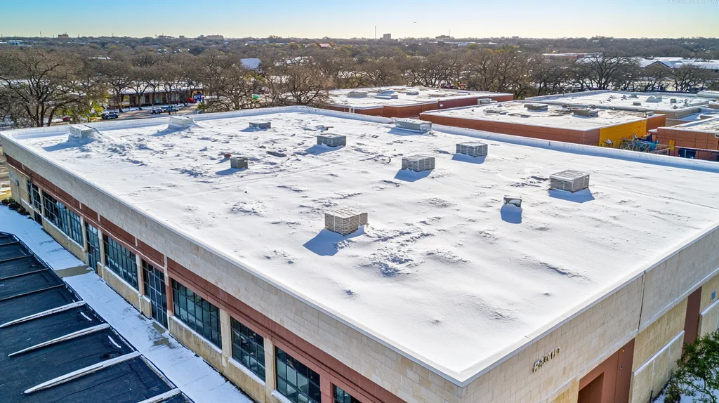 A commercial roof on a post office in a location similar to San Antonio with a snowy day aesthetic (AI image)