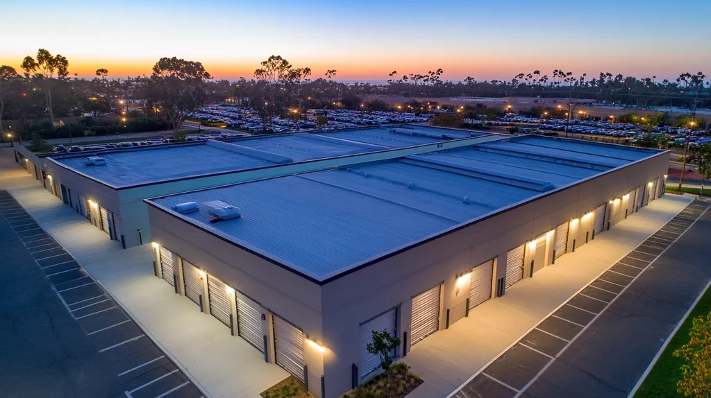 A commercial roof on a storage facility in a location similar to Newport Beach with an illuminated nightscape aesthetic (AI image)