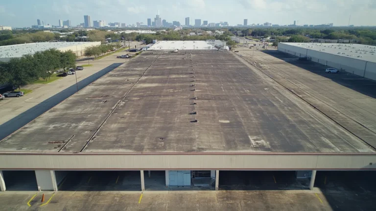 A commercial roof on a warehouse in a location similar to Houston with a cross-processed look aesthetic (AI image)