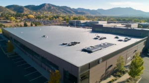 A commercial roof on a manufacturing plant in a location similar to Boulder with a stainless steel aesthetic (AI image)
