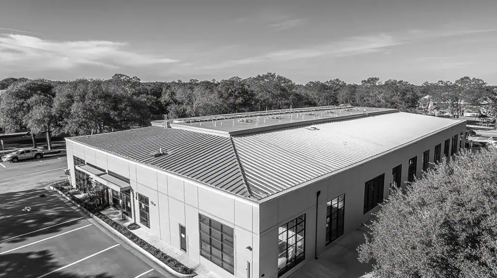 A commercial roof on a data center in a location similar to Charleston with a black and white photography aesthetic (AI image)
