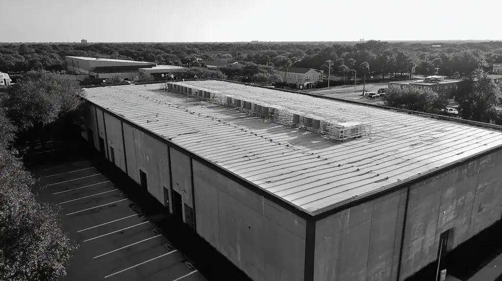 A commercial roof on a data center in a location similar to Charleston with a black and white photography aesthetic (AI image)