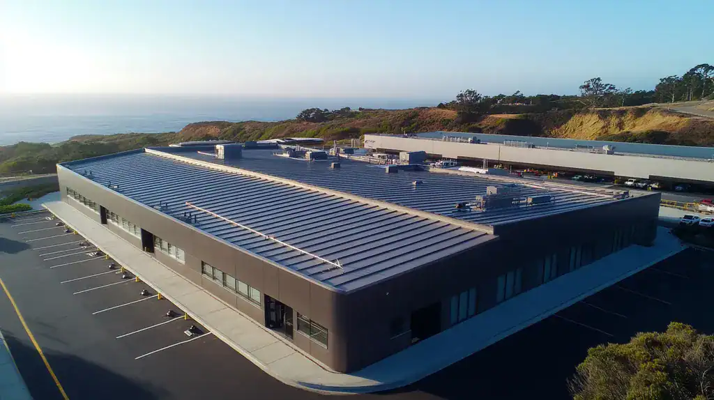 A commercial roof on a warehouse in a location similar to Big Sur with a futuristic aesthetic (AI image)