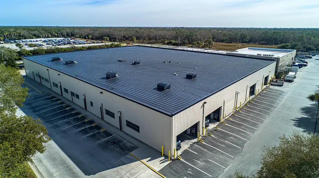 A commercial roof on a warehouse in a location similar to Charleston with a cross-processed look aesthetic (AI image)