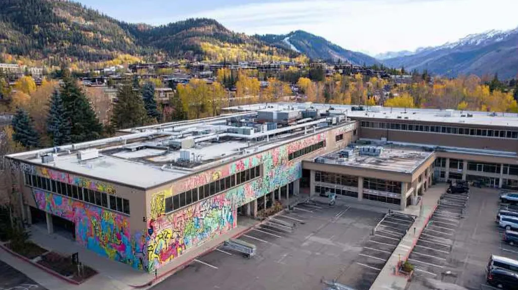 A commercial roof on a hospital in a location similar to Aspen with a graffiti mural aesthetic (AI image)