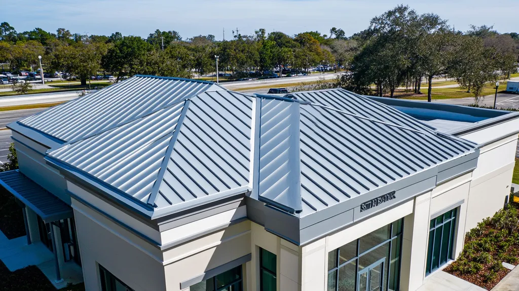 A commercial roof on a bank in a location similar to Tampa with a stainless steel aesthetic (AI image)