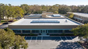 A commercial roof on a school in a location similar to Savannah with a color highlight aesthetic (AI image)
